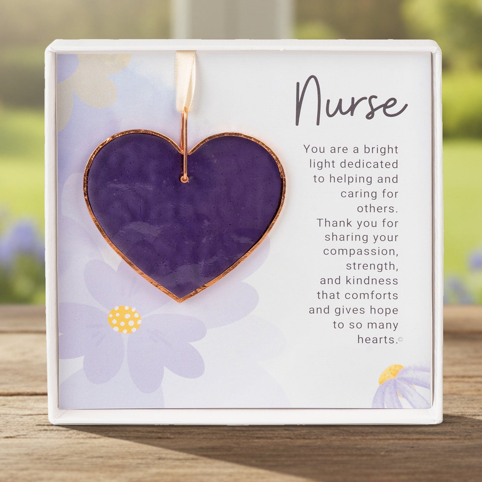 Handmade 3" textured stained glass purple heart with Nurse sentiment in white box with clear lid.