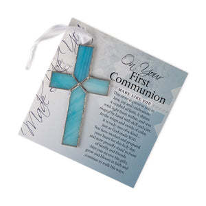 2 of 4:Light blue stained glass cross with lying on the