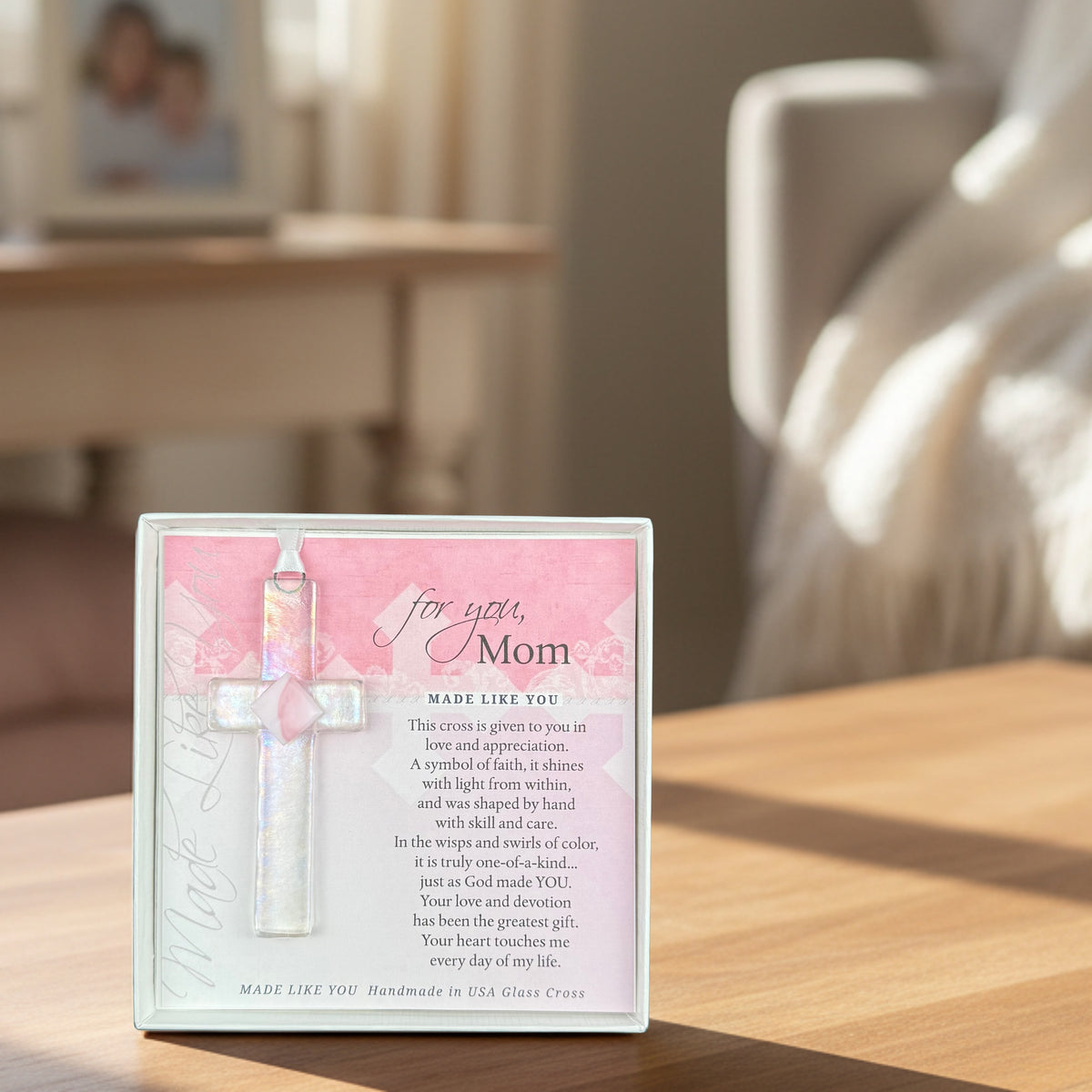 "For You, Mom" cross gift on a table in a living room.