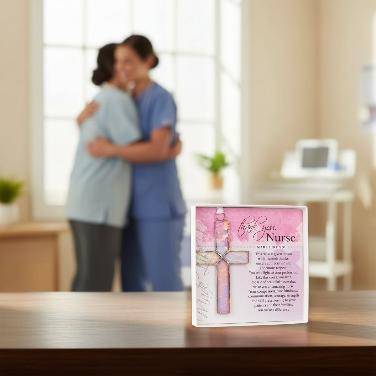 Patient hugging Nurse in the background with the gift displayed on a table.