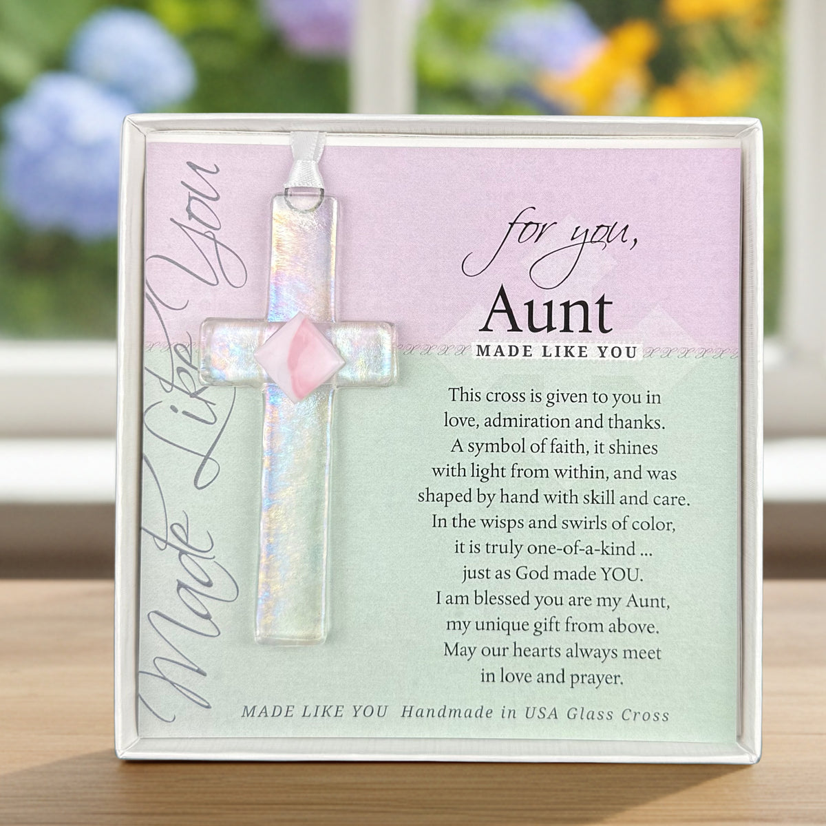For You Aunt: Handmade clear glass cross with pink accent and sentiment; packaged in a white 5.5"x5.5" box with a clear lid.