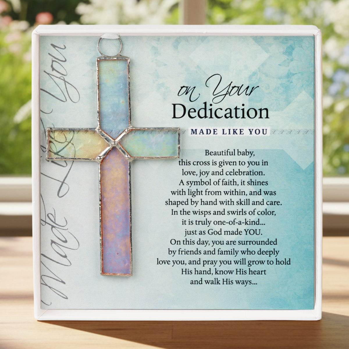4 1/4" handmade clear iridescent stained glass cross hanging with "On Your Dedication" poem printed on cardstock in white gift box with clear lid.