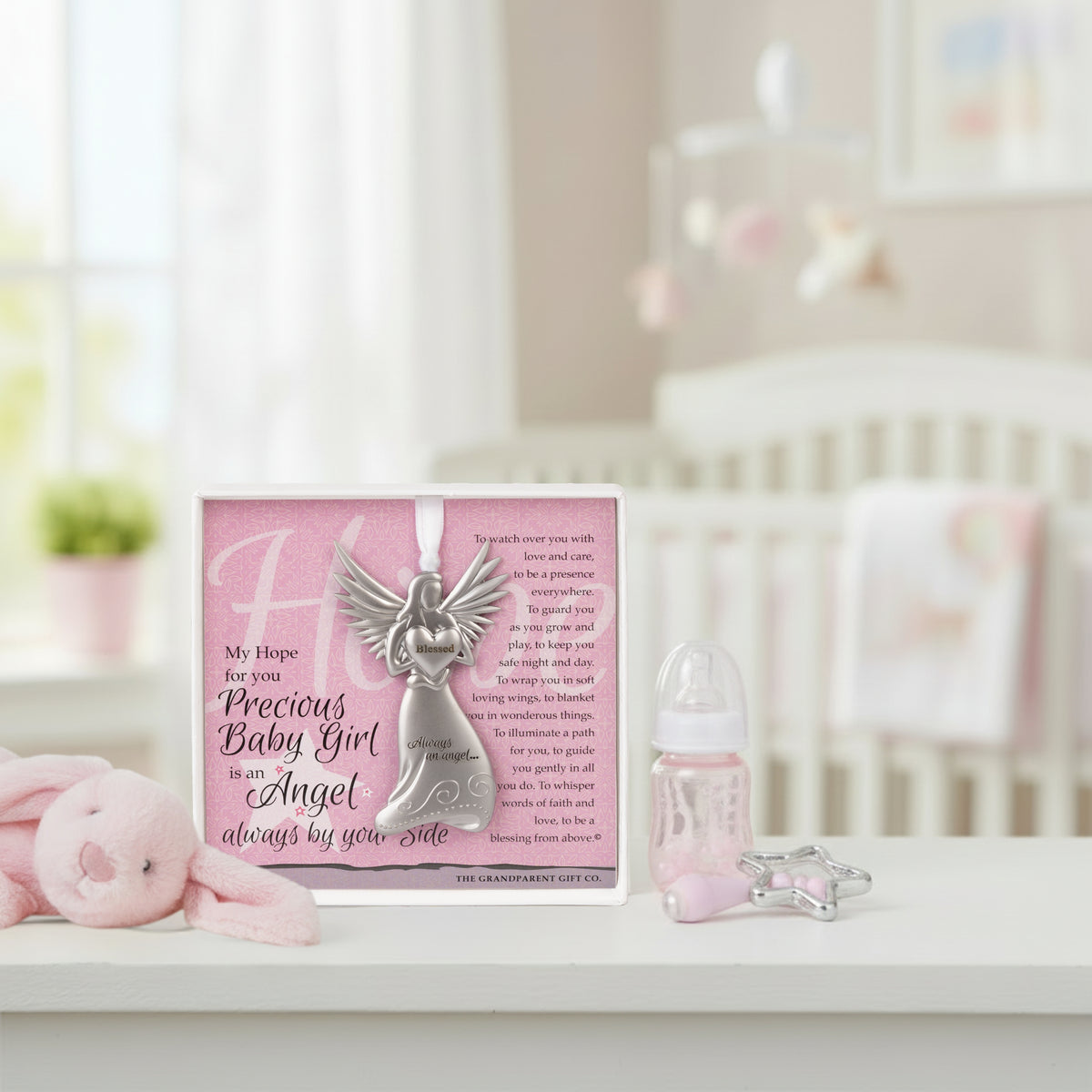 Baby Girl gift sitting on a shelf in a baby girl's room.