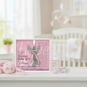 2 of 4:Baby Girl gift sitting on a shelf in a baby girl's room.