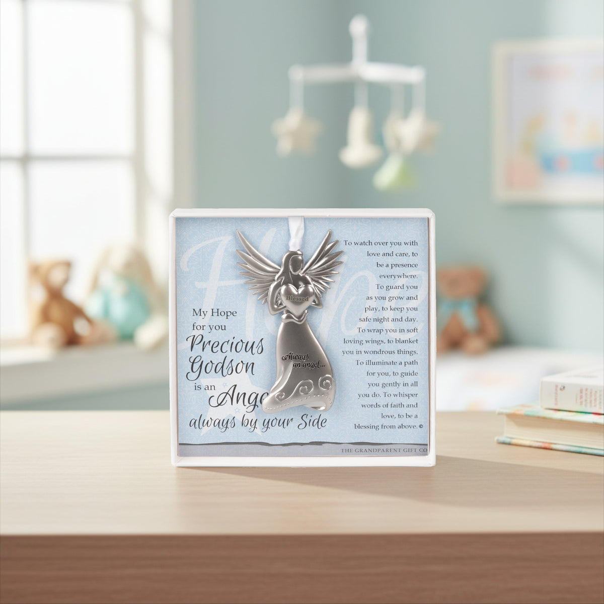 Precious Godson Gift sitting on a shelf in a nursery.