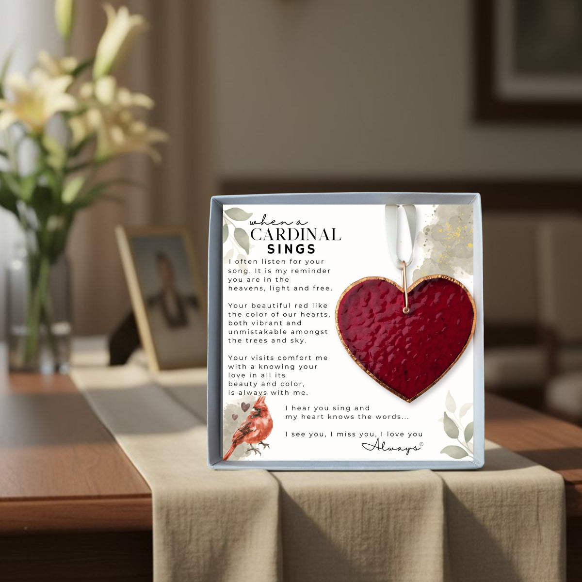 When a Cardinal Sings memorial gift on a table at a funeral.