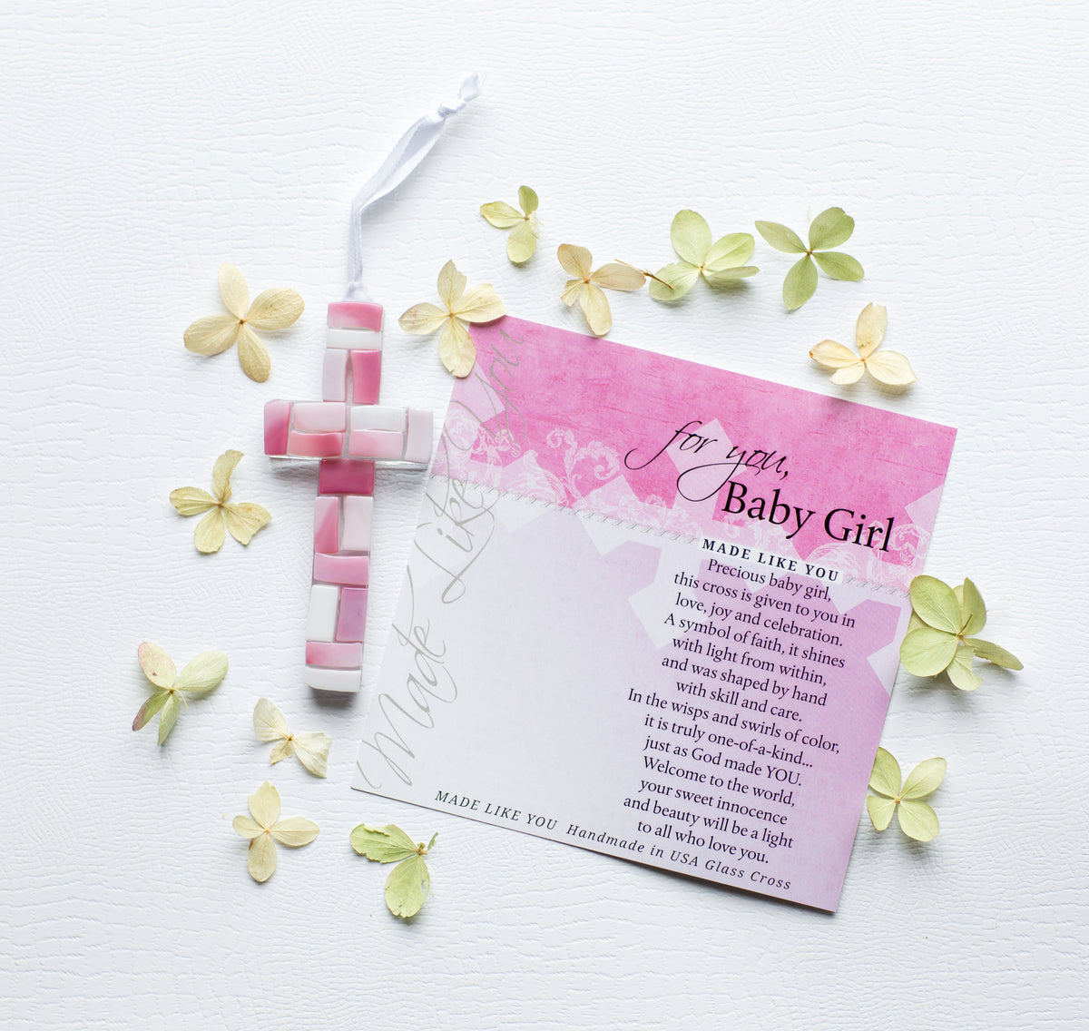 Pink Mosaic cross with shades of pink and white lying next to the For You, Baby Girl sentiment artwork.
