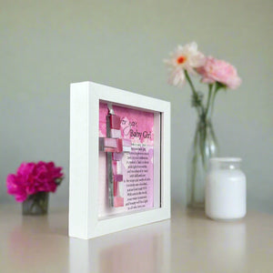 4 of 7:Side view of Baby Girl shadowbox frame shown standing up straight without optional easel back.