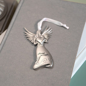 4 of 4:Silver toned metal angel holding a heart with the word