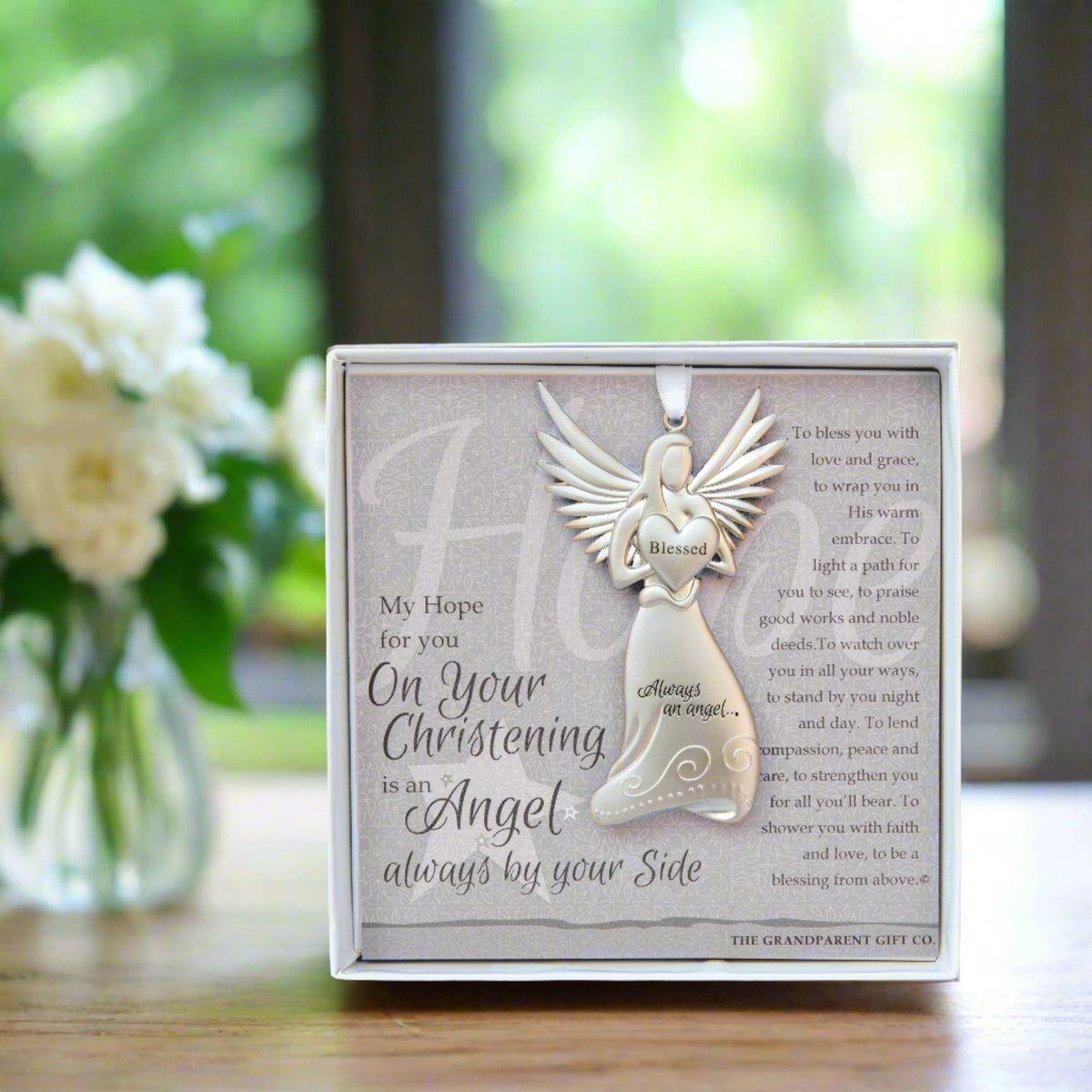 Christening Angel gift on a desk.