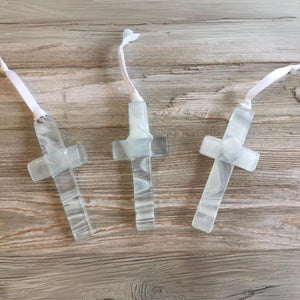 3 of 6:Three white/clear glass handmade glass crosses with white satin ribbons for hanging.