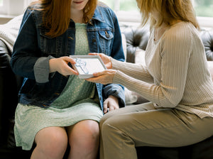 6 of 7:Miscarriage gift being given to a grieving mother.