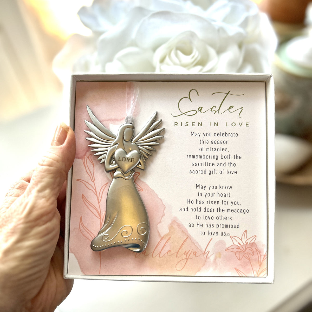 Easter Angel gift being held in a hand.