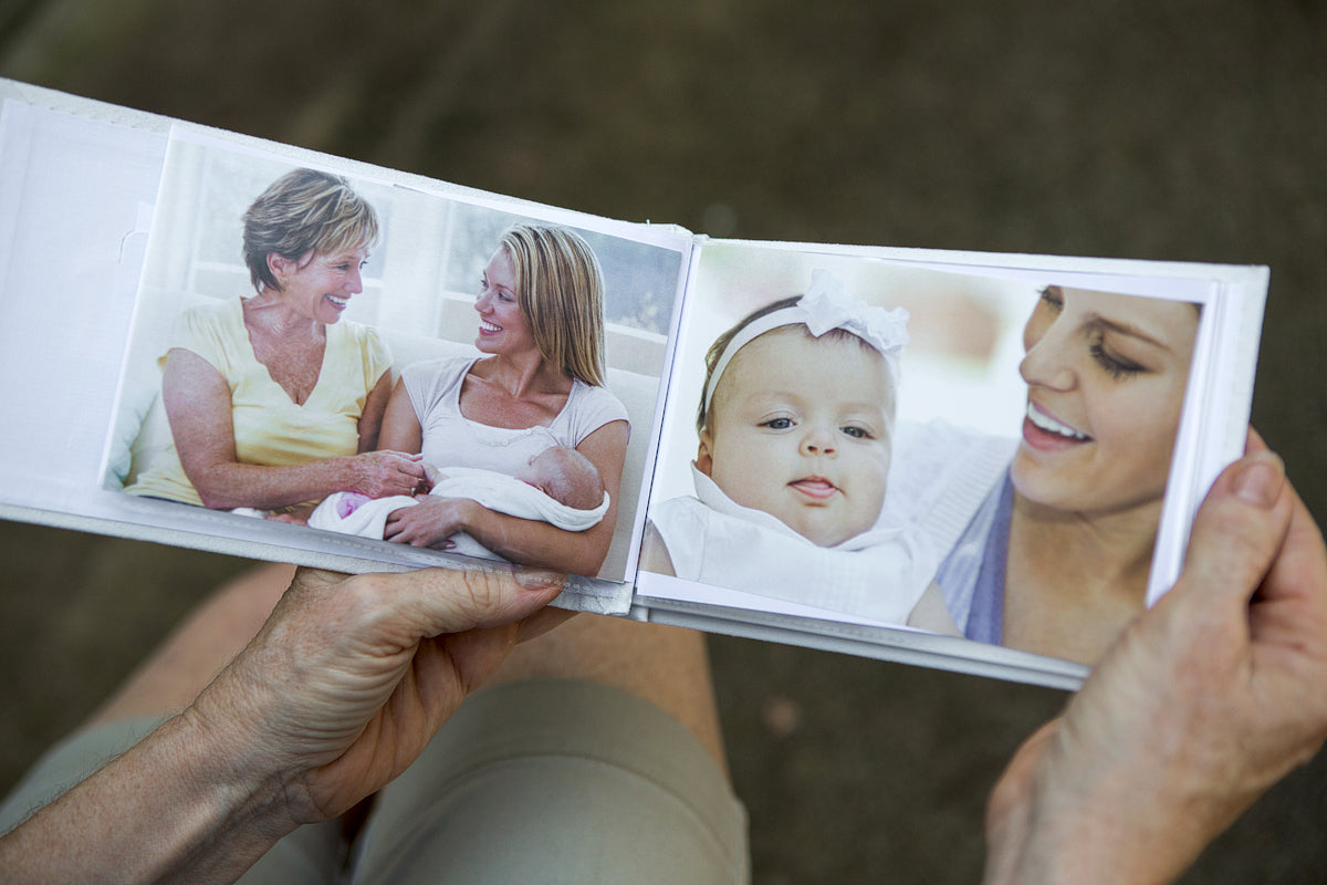 First Grandchild brag book being held open showing the photo pockets.