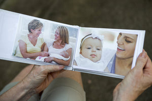6 of 10:First Grandchild brag book being held open showing the photo pockets.
