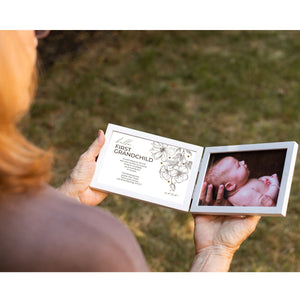 3 of 7:First Grandchild Frame being held in two hands by a Grandmother.