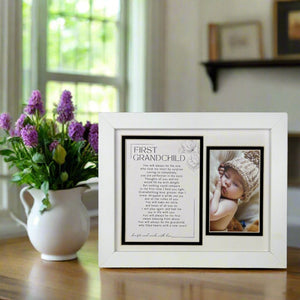 4 of 12:First Grandchild white frame on a table.