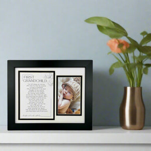 7 of 12:First Grandchild Frame on a fireplace mantle.