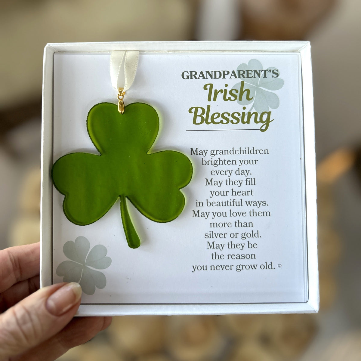 Grandparent's Irish Blessing gift being held in a hand.