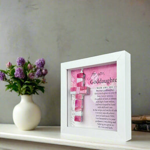 5 of 8:Goddaughter shadowbox on a table.