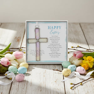 4 of 6:Clear iridescent cross and Easter sentiment on a table with Easter decor.