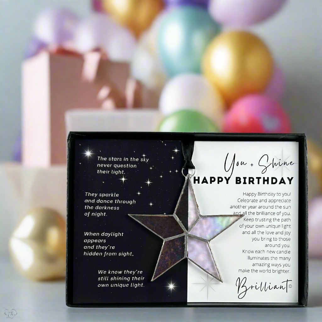 Handmade 4" clear iridescent stained glass star with silver edging, packaged with "You + Shine Happy Birthday" sentiment in black gift box with clear lid.