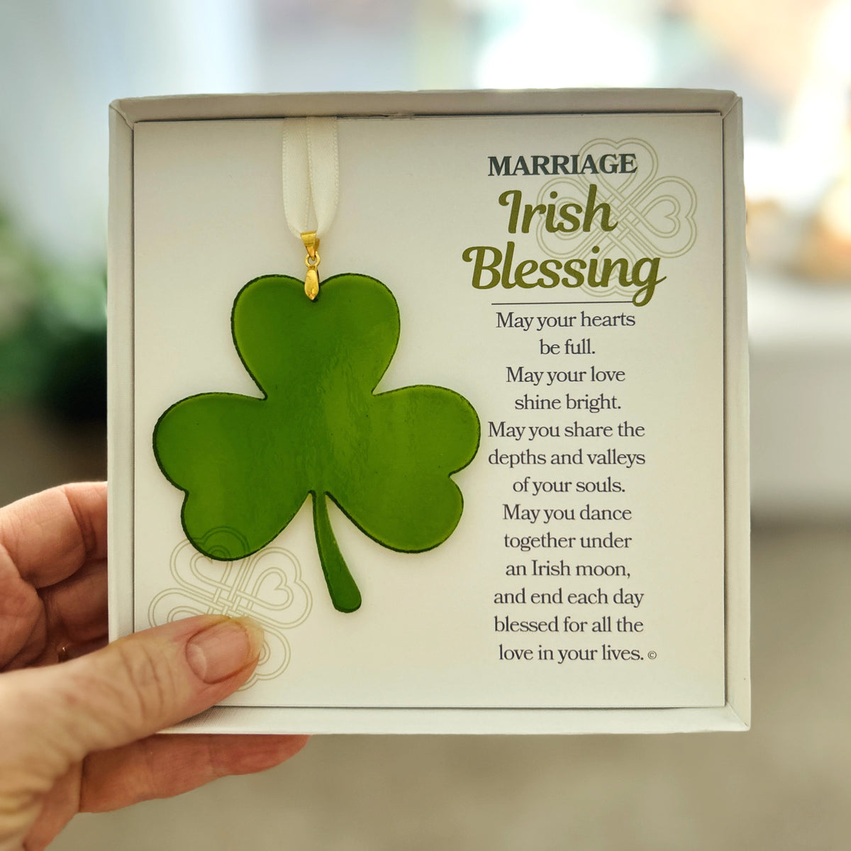 Marriage Irish Blessing anniversary gift being held in a hand.