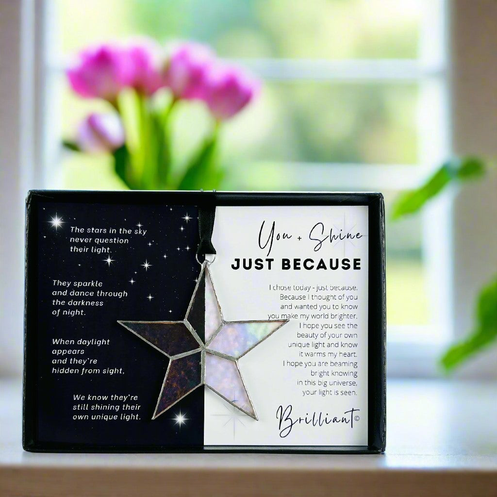 Handmade 4" clear iridescent stained glass star with silver edging, packaged with "You + Shine Just Because" sentiment in black gift box with clear lid.