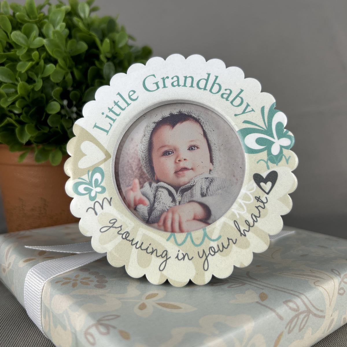 Frame for grandma or grandpa on top of a wrapped gift.