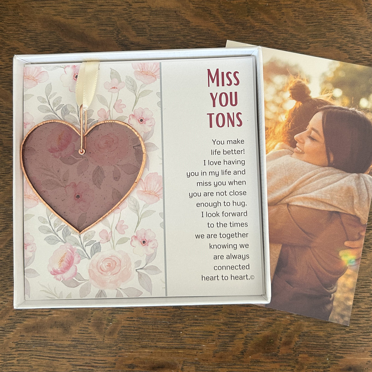 Miss You Tons gift with a photo of friends hugging.