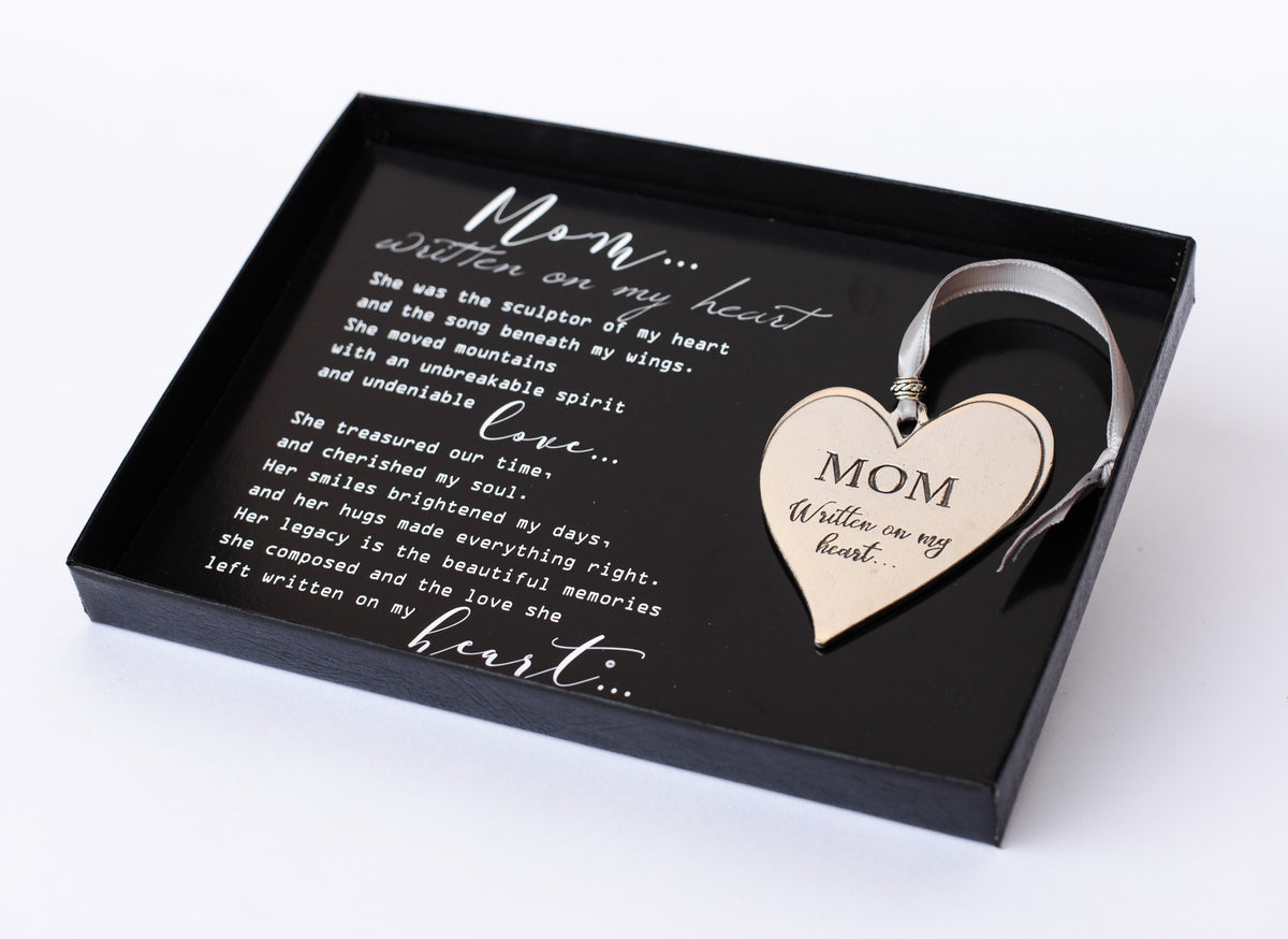 "Mom...Written on My Heart" poem and pewter ornament in a 5x7 box with a clear lid.