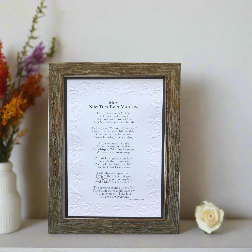 "Mom, Now That I'm A Mother" framed poem on a shelf.