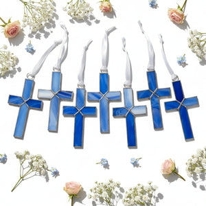 3 of 5:Variety of the blue stained glass crosses showing the unique colors of each piece.