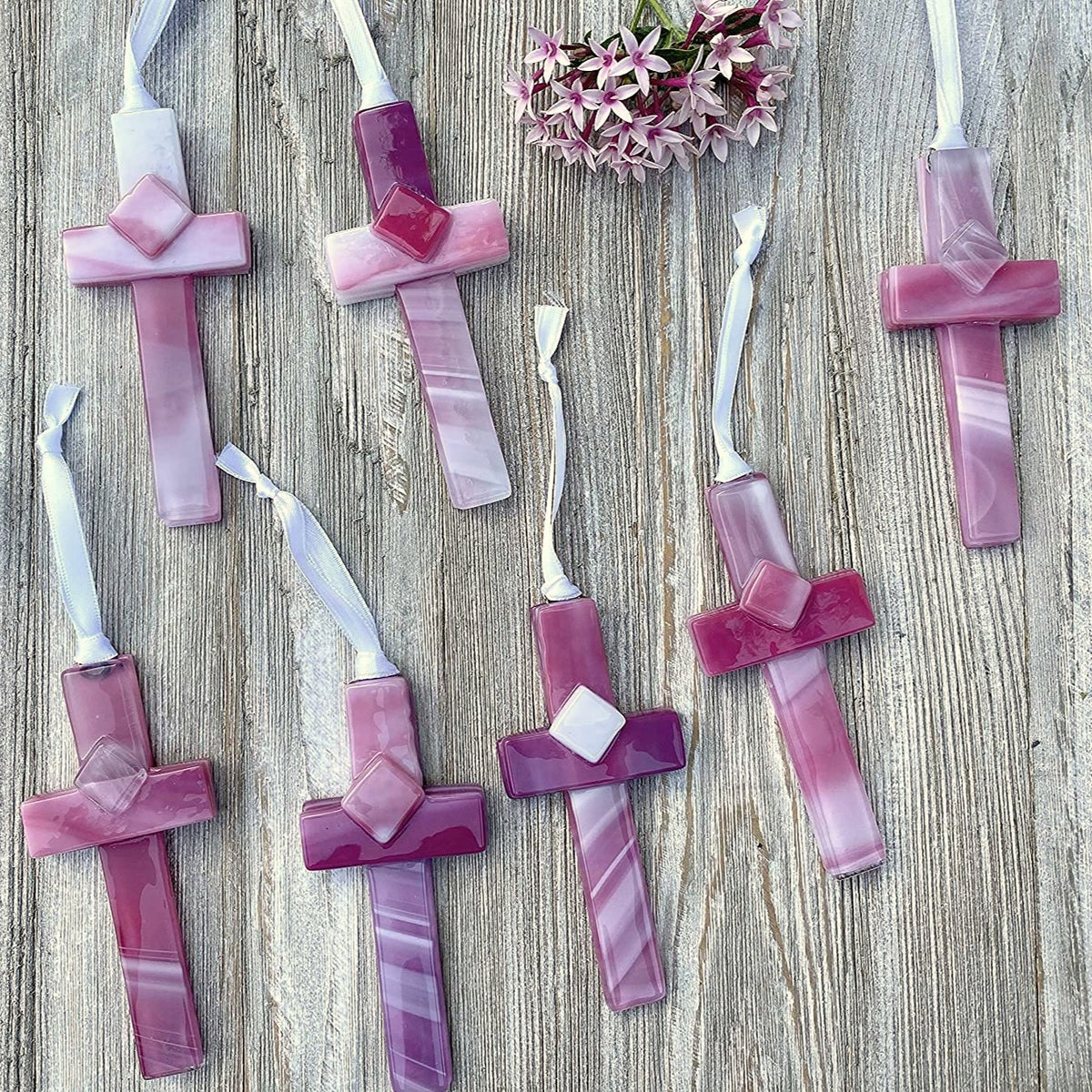 An assortment of pink crosses, each cross is unique.