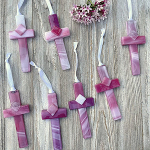 5 of 6:An assortment of pink crosses, each cross is unique.