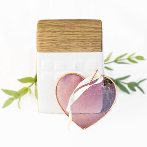 6 of 6:Pink glass heart with bubbles, ripples and texture inherent to handmade glass.