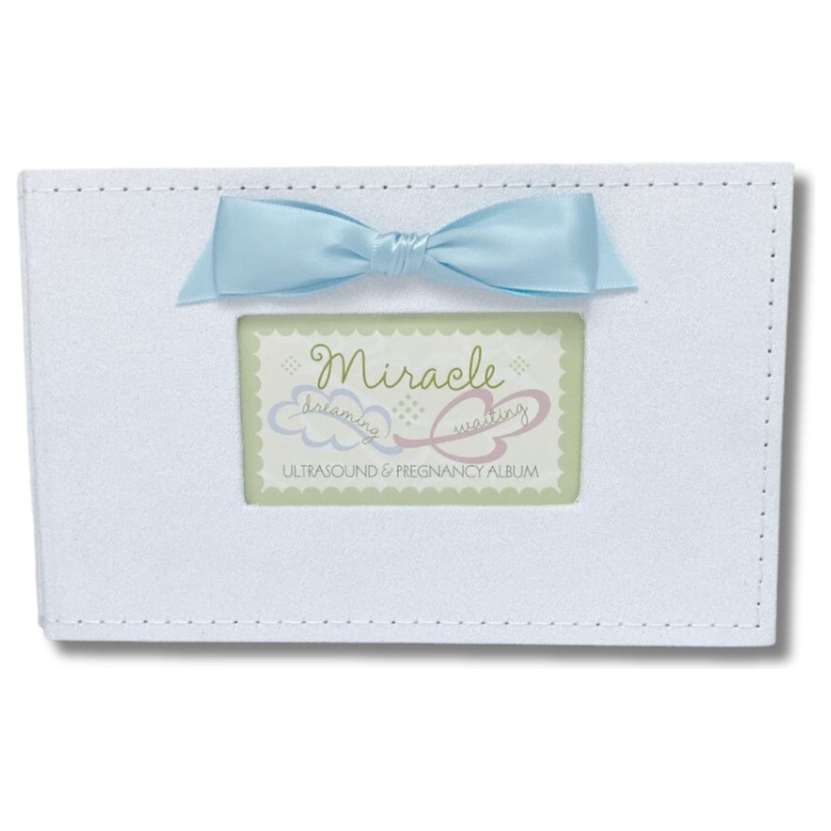 White faux suede photo album with blue satin bow and a window with Miracle sentiment artwork showing.