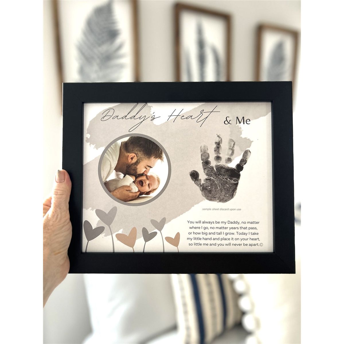 Daddy&#39;s Heart &amp; Me black frame being held in a hand.