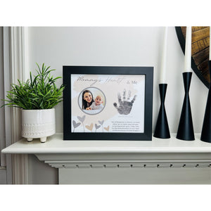 3 of 11:Mommy Handprint frame on fireplace mantle.