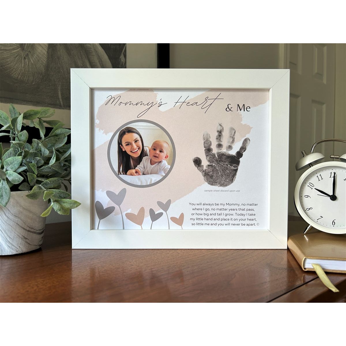 "Mommy's Heart and Me" frame on a dresser.