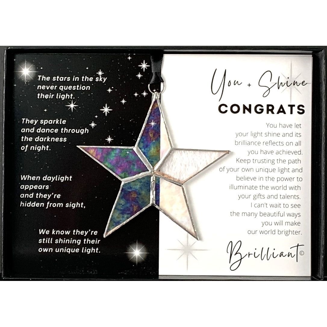 Handmade 4&quot; clear iridescent stained glass star with silver edging, packaged with &quot;You + Shine Congrats&quot; sentiment in black gift box with clear lid.