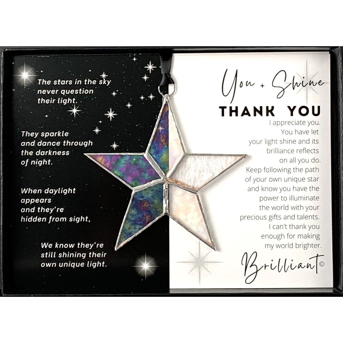 Handmade 4&quot; clear iridescent stained glass star with silver edging, packaged with &quot;You + Shine Thank You&quot; sentiment in black gift box with clear lid.