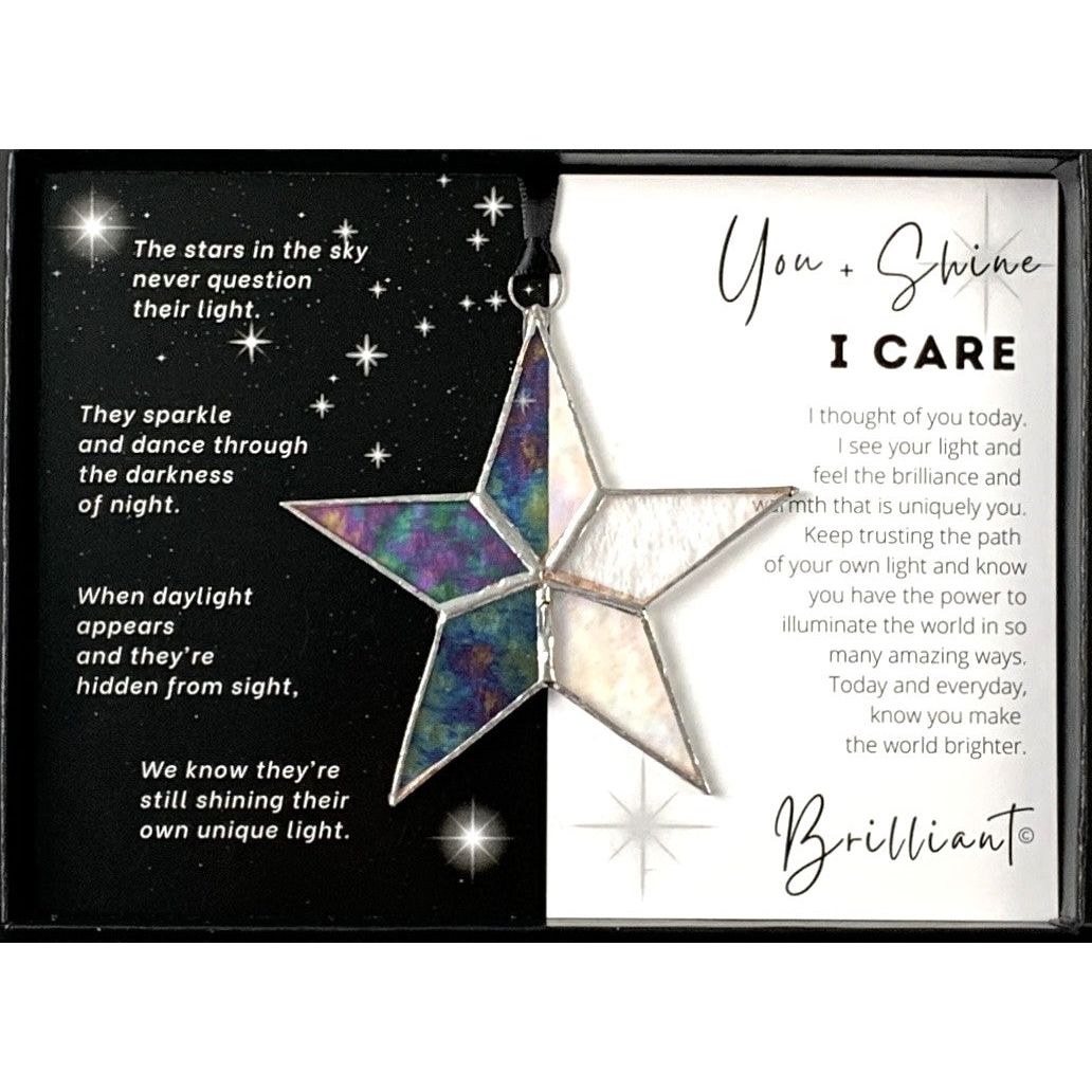 Handmade 4&quot; clear iridescent stained glass star with silver edging, packaged with &quot;You + Shines I Care&quot; sentiment in black gift box with clear lid.