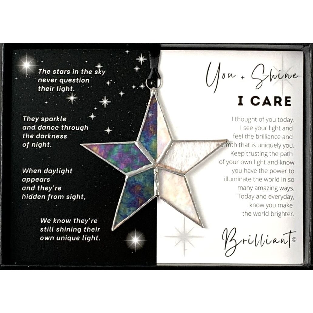 Handmade 4" clear iridescent stained glass star with silver edging, packaged with "You + Shine I Care" sentiment in black gift box with clear lid.