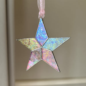 3 of 10:Clear iridescent star hanging from a pink organza ribbon.