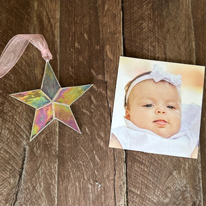 7 of 10:Star with a photo of a baby girl.