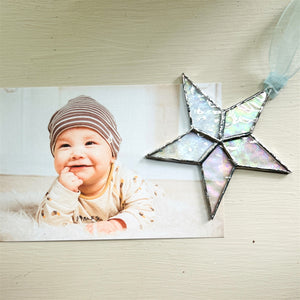7 of 10:Star shown with a photo of a baby.