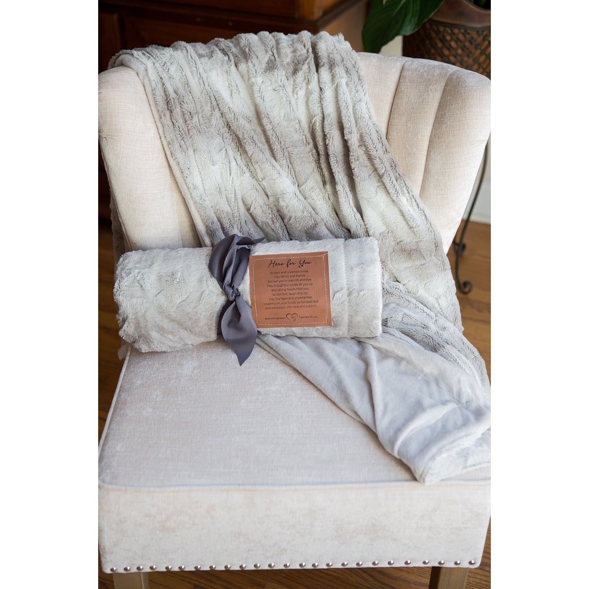 Here for You blanket comes rolled and tied with a wide gray grosgrain ribbon.