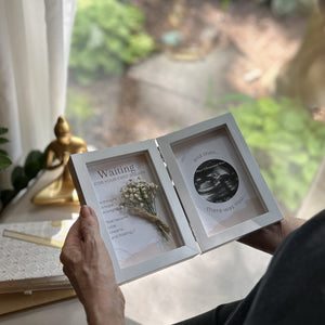 5 of 6:First Breath Ultrasound frame being admired by a grandma.