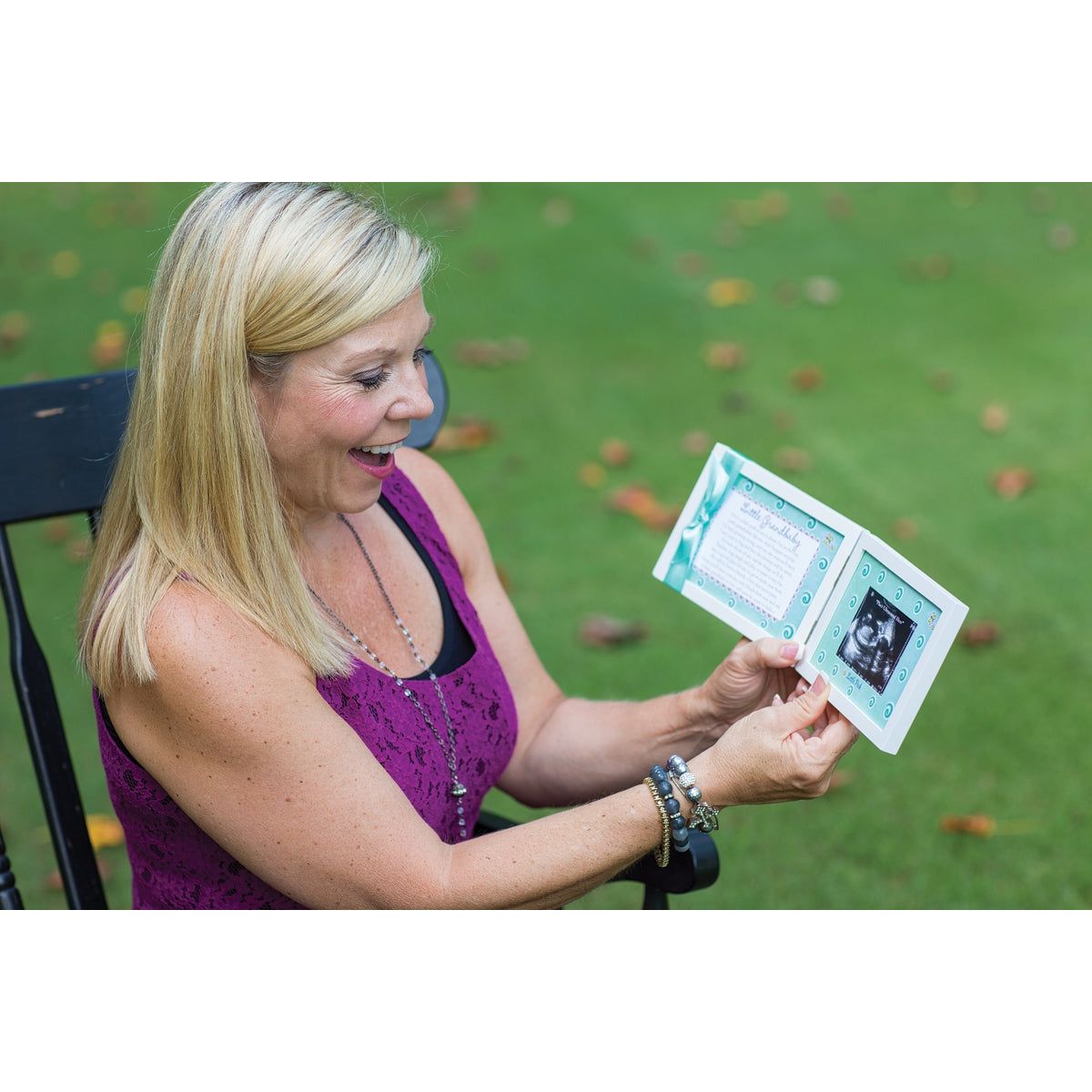 A grandma holding the Little Grandbaby frame.